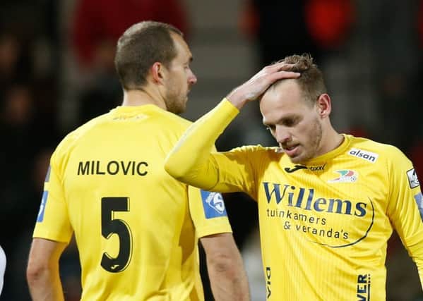 Oostende's Goran Milovic and Oostende's Laurens De Bock look dejected after a soccer game between KV Oostende and Royal Antwerp FC, Saturday 02 February 2019 in Oostende, on the 24th day of the 'Jupiler Pro League' Belgian soccer championship season 2018-2019. BELGA PHOTO BRUNO FAHY        (Photo credit should read BRUNO FAHY/AFP/Getty Images)