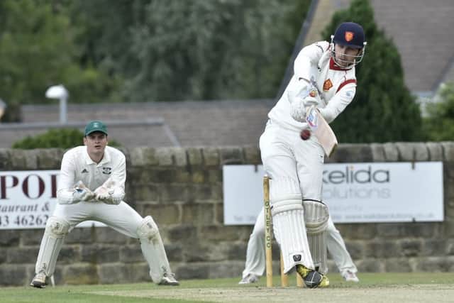 Charlie Bell hits a boundary in his innings of 56 for Pool at Otley. PIC: Steve Riding