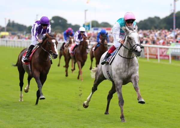 Logician (right) ridden by Frankie Dettori wins The Sky Bet Great Voltigeur Stakes at the Yorkshire Ebor Festival at York Racecourse.