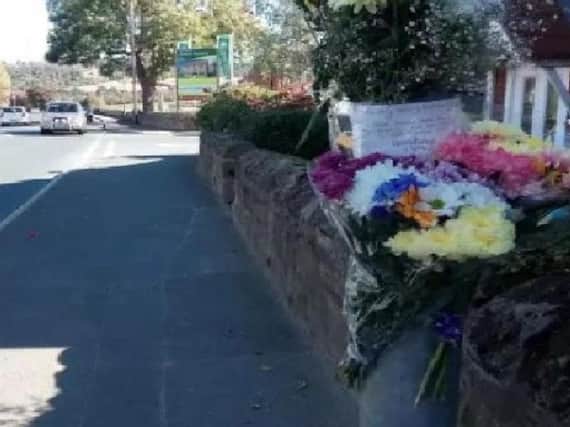 Floral tributes at the scene where Thomas Easton was fatally injured.
