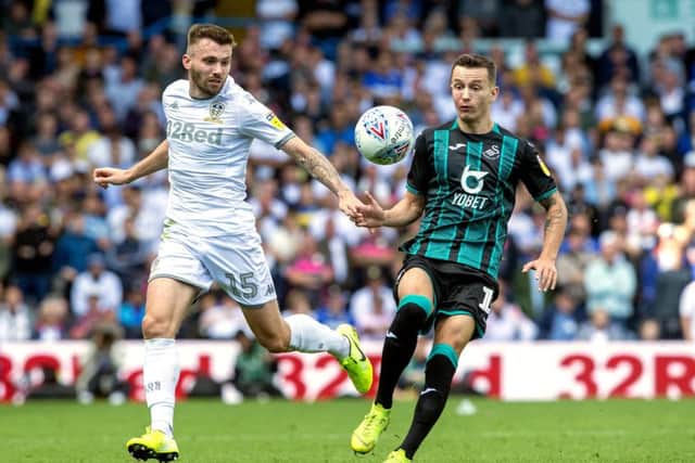 Leeds United's Stuart Dallas and Swansea's Bersant Celina battle for the ball. Picture Bruce Rollinson