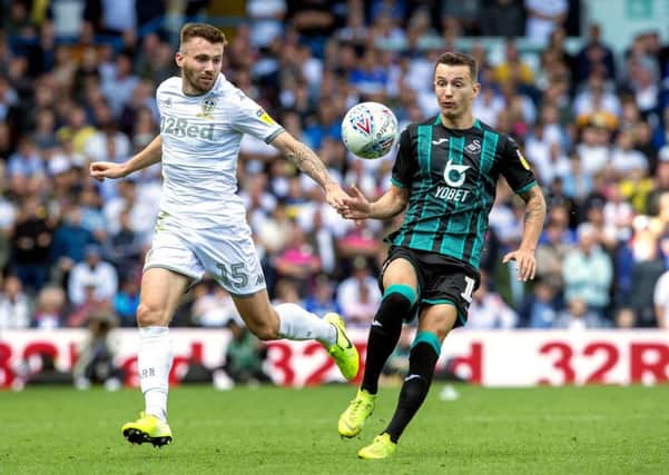 Leeds United's Stuart Dallas and Swansea's Bersant Celina battle for the ball. Picture Bruce Rollinson