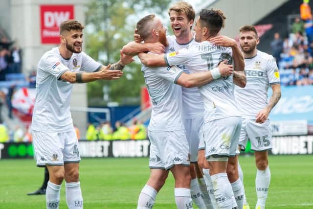 LOVING LIFE: Leeds United's no 9 Patrick Bamford is mobbed by Adam Forshaw and Pablo Hernandez as Mateusz Klich and Stuart Dallas look on following his opening strike in last month's 2-0 win at Wigan Athletic. Picture by Bruce Rollinson.