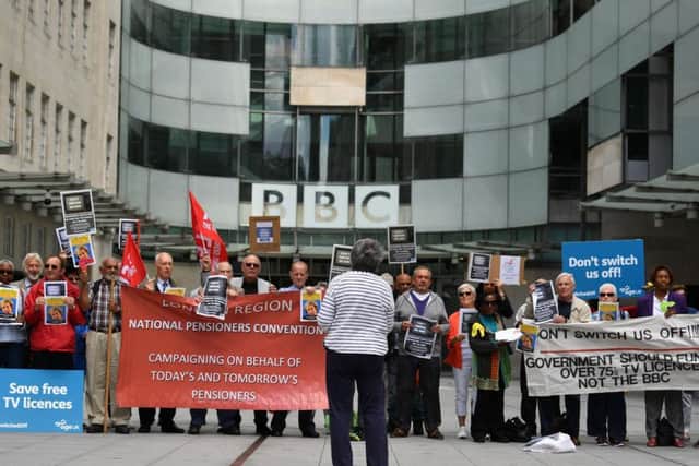 Senior citizens protesting outside the BBC London offices (BEN STANSALL/AFP/Getty Images)