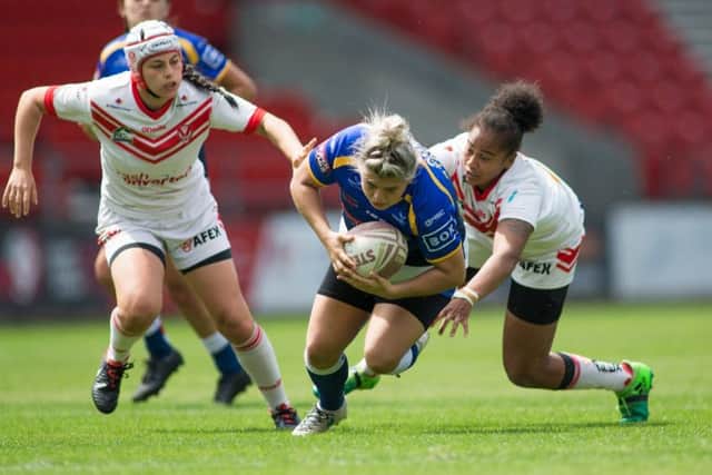 Leeds Rhinos' Aimee Staveley is tackled by Channy Crowl of St Helens during the clash between the two sides in July.