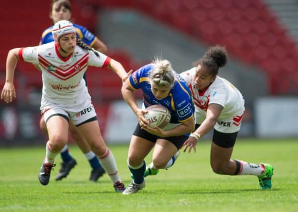 Leeds Rhinos' Aimee Staveley is tackled by Channy Crowl of St Helens during the clash between the two sides in July.