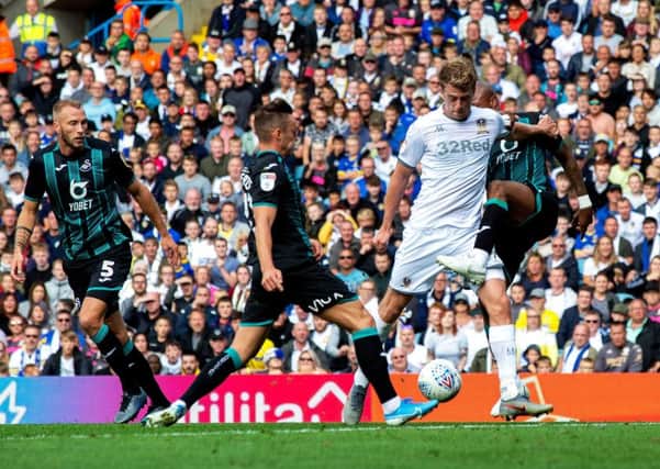 Patrick Bamford and Swansea's Andrew Ayew clash for the ball.