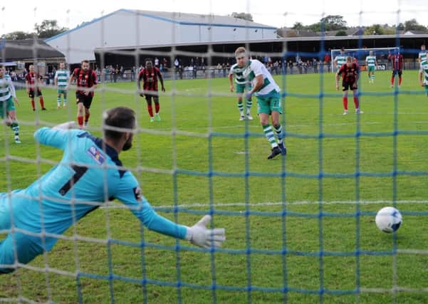 Ben Atkinson puts his penalty wide  for Farsley Celtic against Kettering Town yesterday.