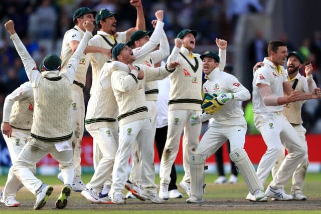 Australia celebrate after they claimed victory to retain the Ashes at Old Trafford. Picture: Mike Egerton/PA