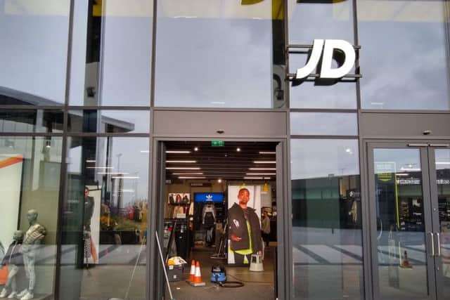 There was little evidence of damage at JD Sports on Monday morning after the raid.
