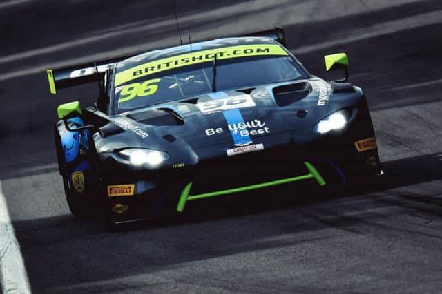Ollie Wilkinson at the wheel of his Aston Martin.
