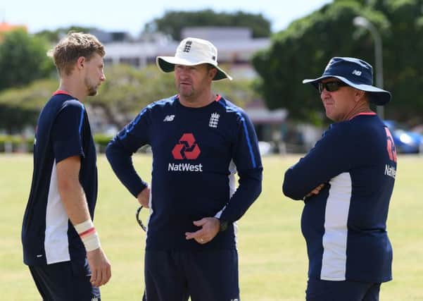 England assistant coach Paul Farbrace talks with captain Joe Root, left, and head coach Trevor Bayliss during net practice in Bridgetown earlier this year. Picture: Shaun Botterill/Getty Images
