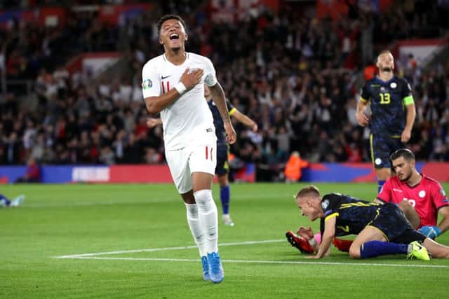 England's Jadon Sancho celebrates scoring his side's fourth goal.