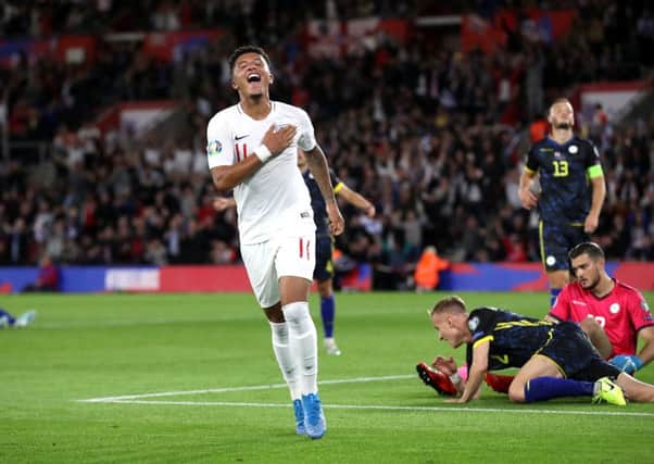 England's Jadon Sancho celebrates scoring his side's fourth goal.