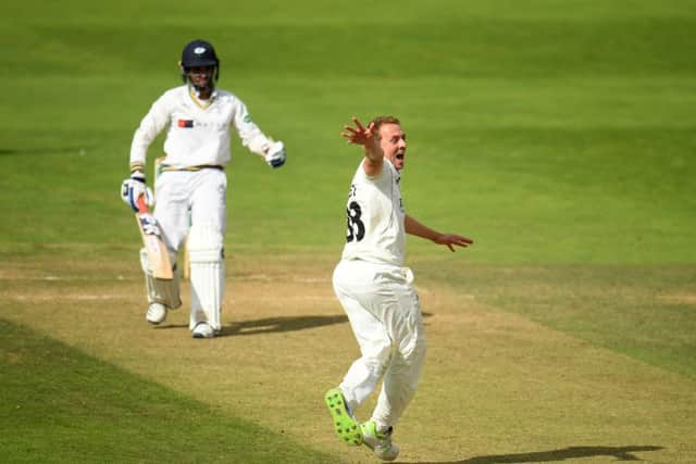 GOT HIM: Somerset's Josh Davey celebrates the wicket of Keshav Maharaj on day three at Taunton. Picture: Harry Trump/Getty Images.