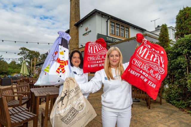 The Leeds Homeless Street Angels Becky and Shelley Joyce launch their Christmas Sack Appeal at the Lord Darcy pub