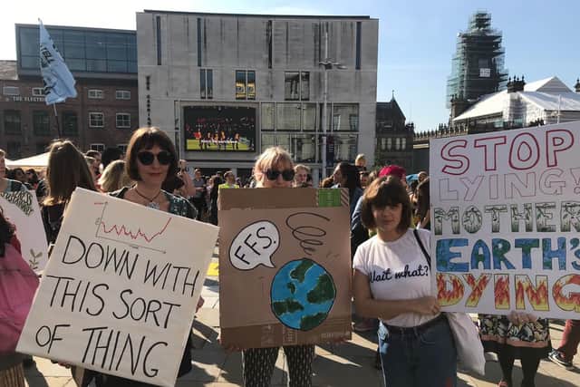 Extinction Rebellion activists gather for strike in Millennium Square