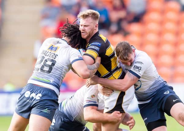 WE MEET AGAIN: York's Perry Whiteley is tackled by Featherstone's Josh Walters when the two teams met in the 2019 Summer Bash at Blackpool in May. Picture: Allan McKenzie/SWpix.com