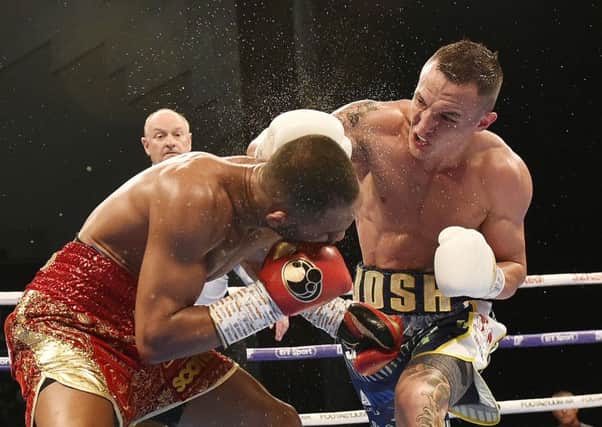 Josh Warrington lands a blow on rival Kid Galahad during their First Direct Leeds Arena clash in June. Picture: Steve Riding.