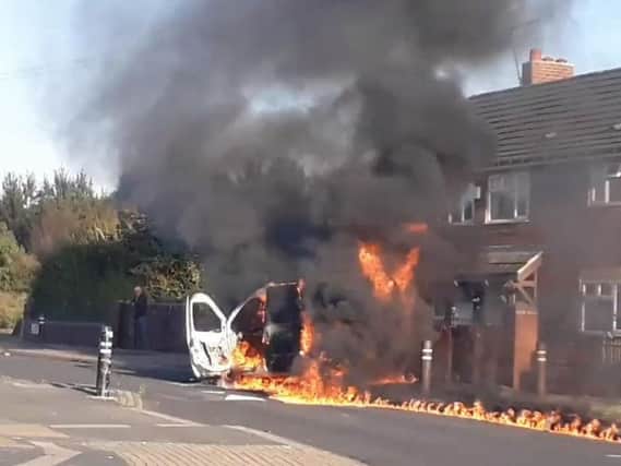 A 13-year-old boy arrested and a man charged after a van was set on fire in Halton Moor