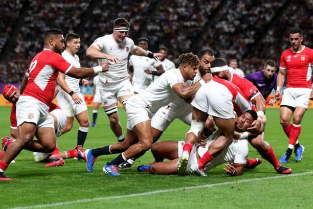 England's Manu Tuilagi scores his side's first try against Tonga at Sapporo Dome. PA Photo. Picture: David Davies/PA