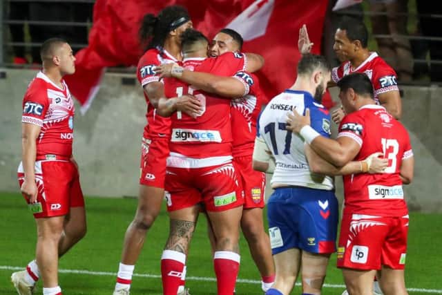 Tonga celebrate the win. Picture: John Cowpland / www.photosport.nz /SWpix.com