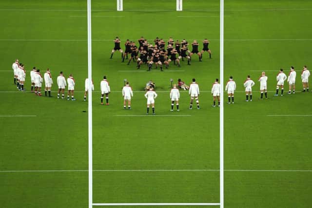 ENVELOPE: England players look on while New Zealand players perform a haka at Stadium Yokohama. Picture: Dan Mullan/Getty Images