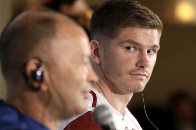 England captain Owen Farrell, right, looks at coach Eddie Jones and during a press conference in their team hotel in Tokyo. Picture: AP/Mark Baker