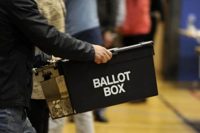 Ballot boxes are carried into the hall at the Richard Dunn Centre, Bradford, for counting in the 2015 General Election. Pic: Bruce Rollinson