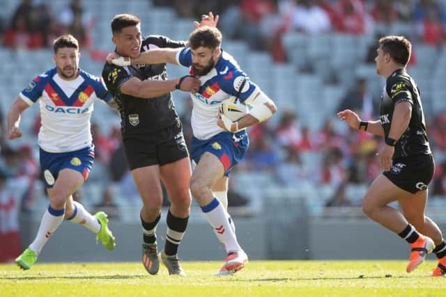 Lions forward Alex Walmsley drives forward