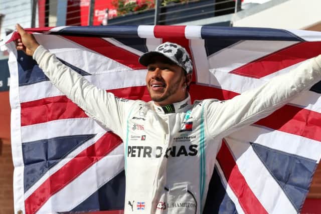 Mercedes driver Lewis Hamilton celebrates winning his sixth world championship after the United States Grand Prix.