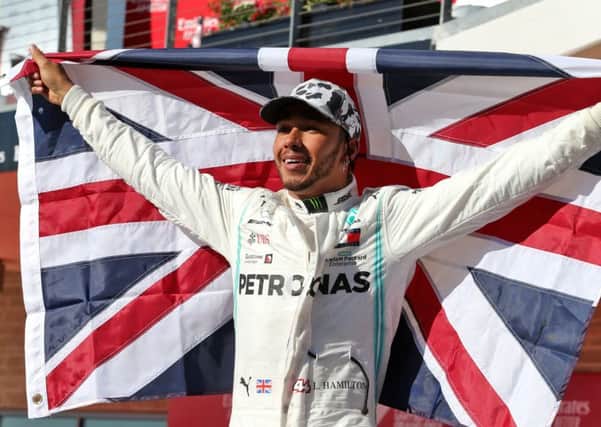 Mercedes driver Lewis Hamilton celebrates winning his sixth world championship after the United States Grand Prix.