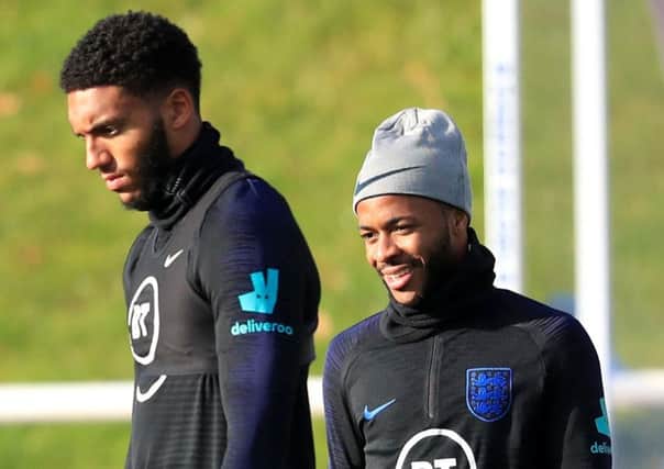 England's Joe Gomez (left) and Raheem Sterling during the training session at St George's Park, Burton.