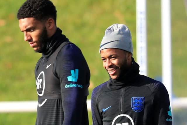 England's Joe Gomez (left) and Raheem Sterling during the training session at St George's Park, Burton.