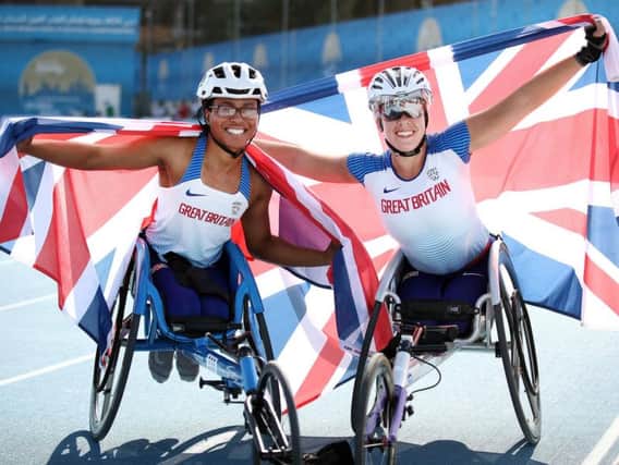 Hannah Cockroft (right - 1st) and Kare Adenegan (left - 2nd) of Great Britain celebrate finishing first and second in the Women's 800m T34 during Day Eight of the IPC World Para Athletics Championships 2019 Dubai.