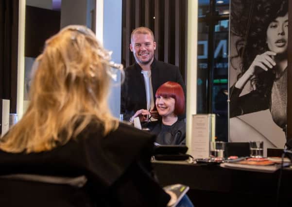 Hairdresser of the Year 2019 nominee Robert Eaton, pictured with clients at the Leeds Russell Eaton salon. 
Picture James Hardisty.