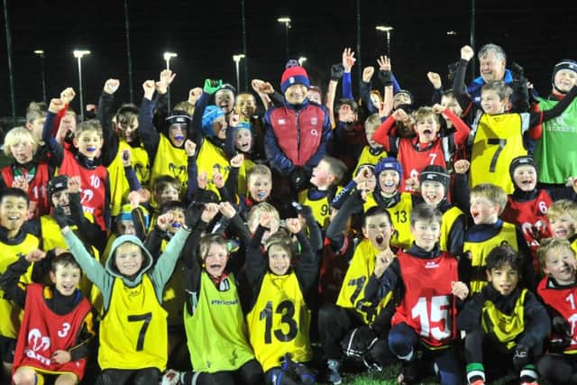 NLYP Jones.       England  rugby union coach Eddie Jones with youngsters at The Grammar School at Leeds where he officially opened their new artificial pitch.