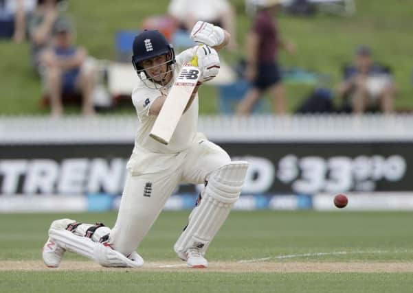 CLASS ACT: England's Joe Root drives through the covers on his way to a century on day three of the second Test against against New Zealand at Seddon Park. PIcture: AP Photo/Mark Baker