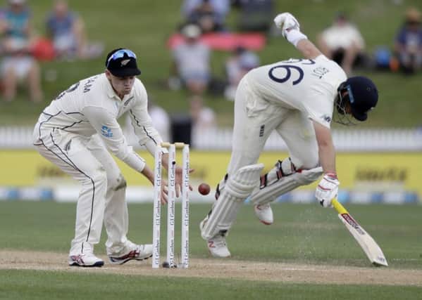 Can't get me out: New Zealand's Tom Latham, left, looks to catch the ball as England's Joe Root runs to make his ground during play on day four of the second cricket test between England and New Zealand at Seddon Park (AP Photo/Mark Baker)
