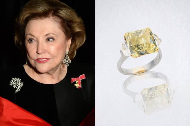 Barbara Taylor Bradford wearing the chandelier diamond earrings, and the fancy yellow diamond ring, which sold in auction at Bonhams London. Credit: Bonhams