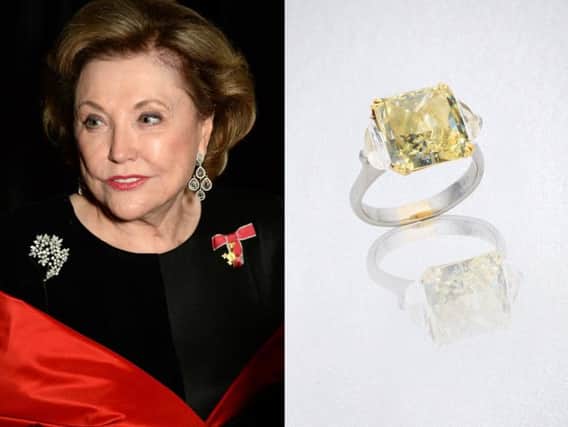 Barbara Taylor Bradford wearing the chandelier diamond earrings, and the fancy yellow diamond ring, which sold in auction at Bonhams London. Credit: Bonhams