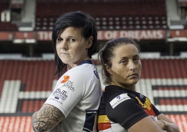 Featherstone's Woman's captain Natalie Harrowell, pictured with Bradford Bulls' captain Kirsty Moroney. Picture: Allan McKenzie/SWpix.com