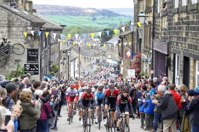 Team INEOS lead the peloton in Haworth, during stage four of the Tour de Yorkshire on Sunday May 5, 2019. Picture: Martin Rickett/PA Wire