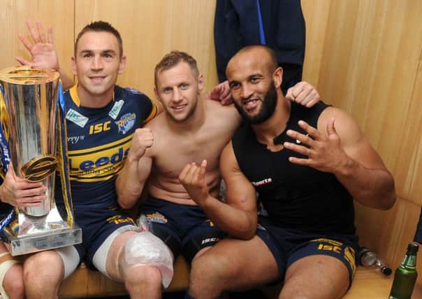 Reunited: Kevin Sinfield, Rob Burrow and Jamie Jones-Buchanan celebrtae a sixth Grand Final in 2012. (Picture: Steve Riding)