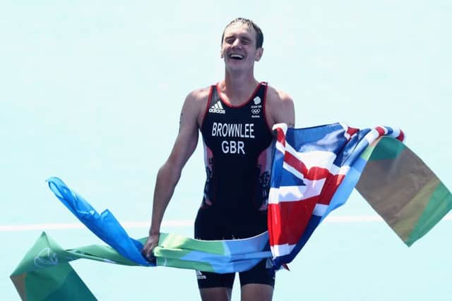 Alistair Brownlee crosses the line in Rio after defending his Olympic title.