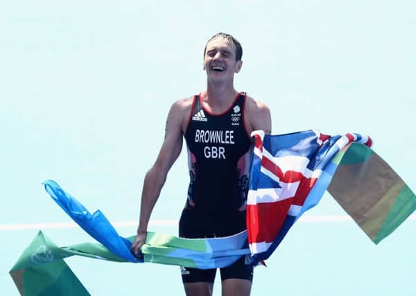 Alistair Brownlee crosses the line in Rio after defending his Olympic title.