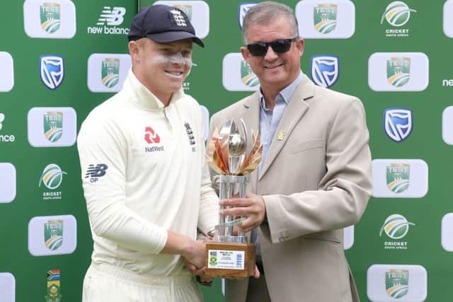 Top man: England's Ollie Pope, left, receives the man of the match trophy from Donovan May, president of Eastern Province cricket. Picture: AP Photo/Michael Sheehan