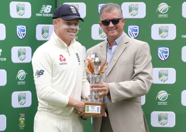 Top man: England's Ollie Pope, left, receives the man of the match trophy from Donovan May, president of Eastern Province cricket. Picture: AP Photo/Michael Sheehan