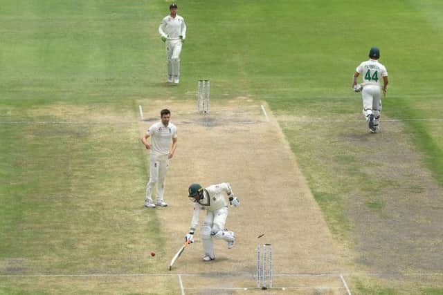 South Africa batsman Keshav Maharaj is run out by Sam Curran (not pictured)  as Mark Wood celebrates and England take the final wicket in Port Elizabeth. Picture: Stu Forster/Getty Images