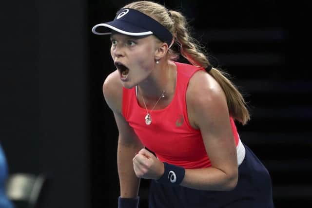 OUT: Harriet Dart reacts during her second round singles match against Romania's Simona Halep in Melbourne. Picture: AP/Dita Alangkara